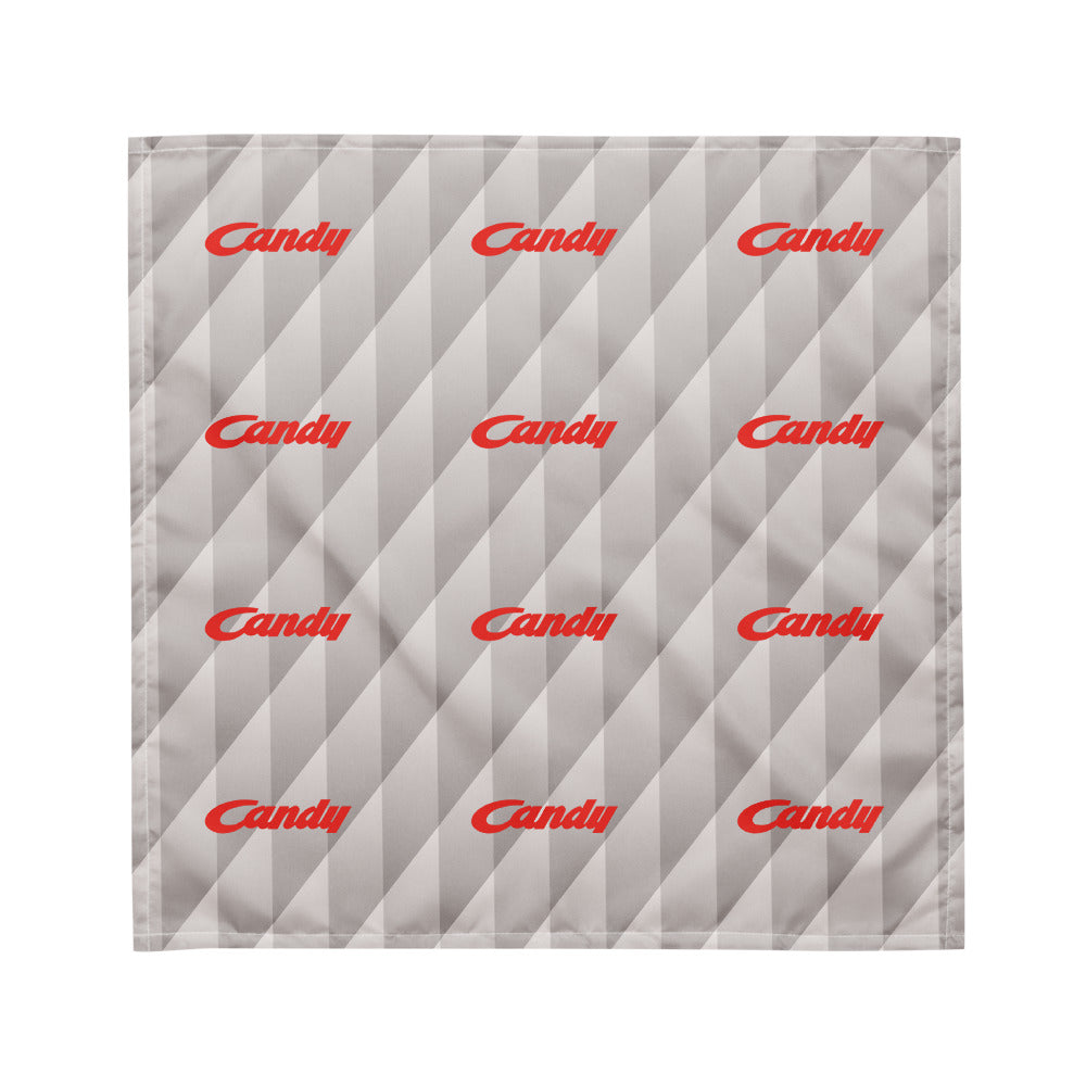 A square gray fabric item, likely a pocket square or napkin, featuring a diagonal striped pattern and repeated red 'Candy' script logos, shown on a plain white background.