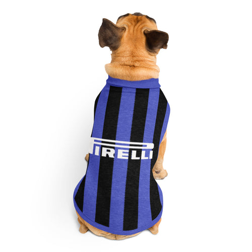 A small tan dog seen from behind wearing a blue and black striped pet shirt with a white Pirelli logo, photographed on a clean white background.