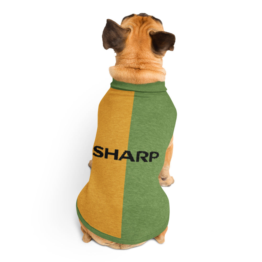 A tan dog viewed from behind wearing a short-sleeve pet shirt with a vertical split design in mustard yellow and green, featuring the word 'SHARP' printed in black across the back.
